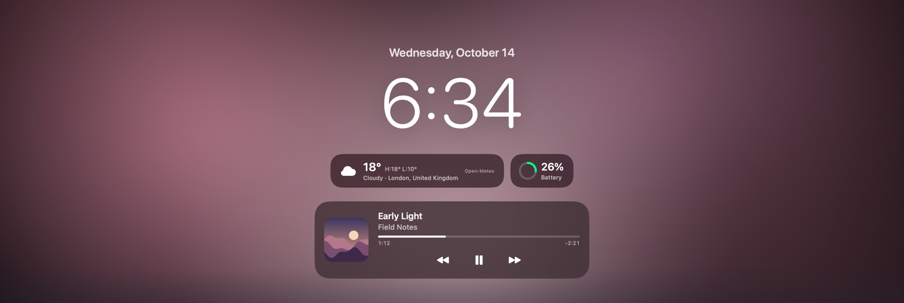 The lock screen: date, a large clock, weather, battery and what's playing.